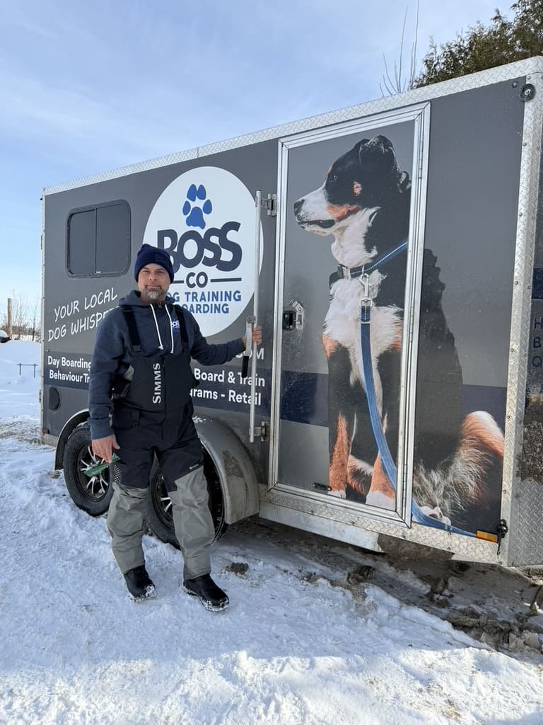 Person by trailer with giant dog graphic